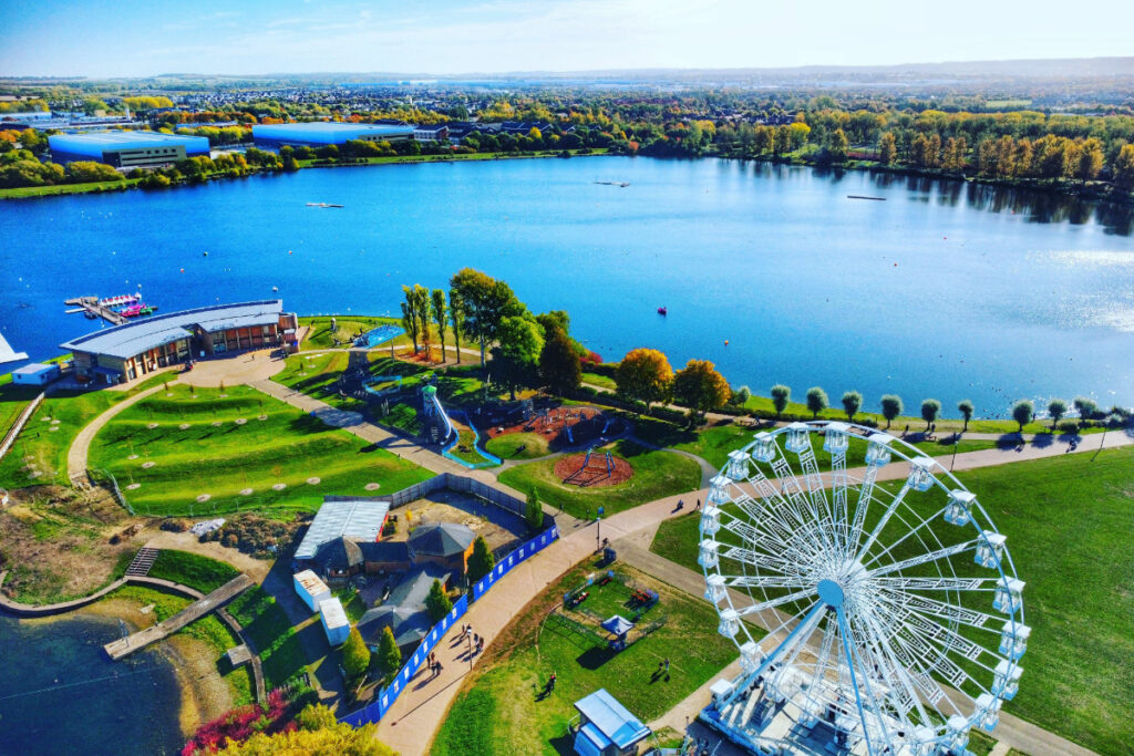 An aerial photo showing Willen lake and the surrounding area of Milton Keynes.