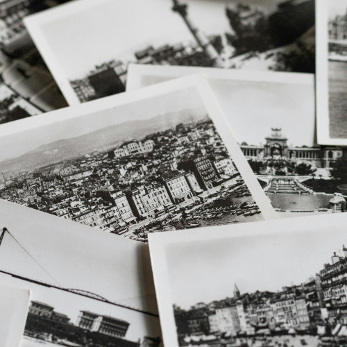 A photo showing a collection of vintage polaroid printed photos.