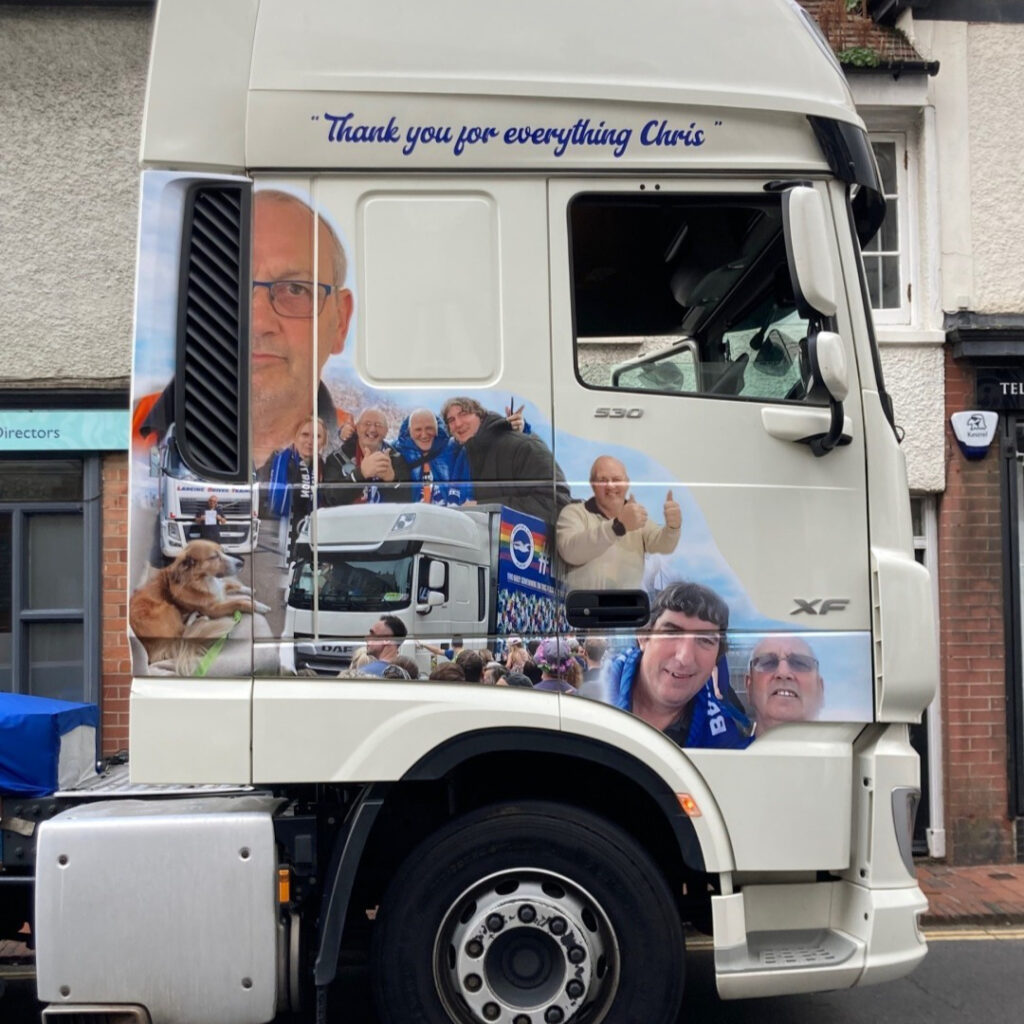A photo of a sign written lorry that has been personalised to honour the person who has died.