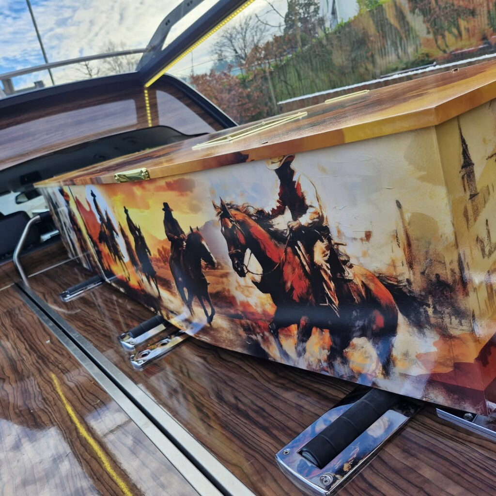 A photo of a personalised coffin in the back of a hearse.